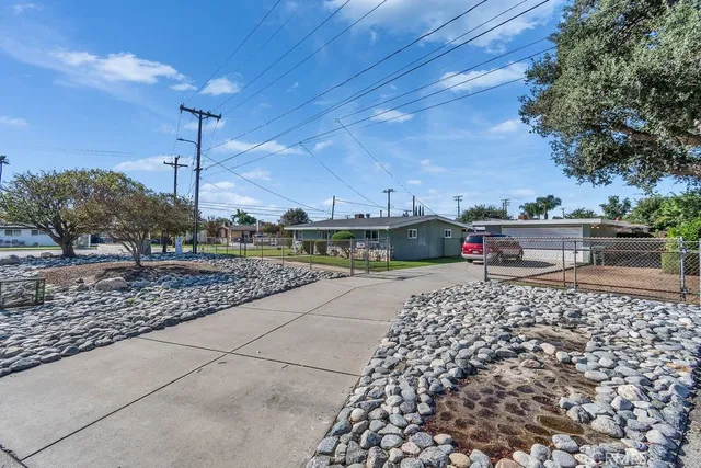 a view of a street with a building in the background