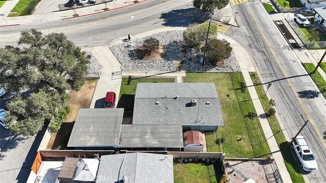 an aerial view of residential houses with outdoor space