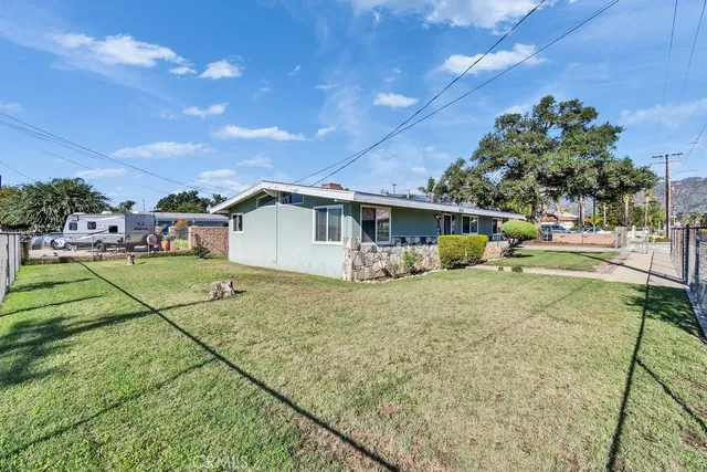 a view of a house with basketball court