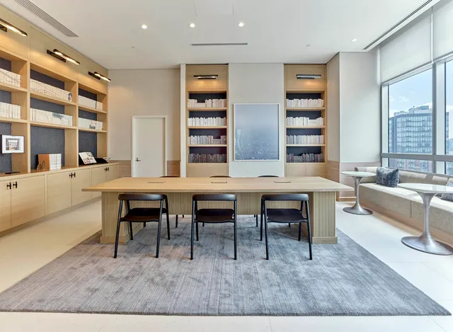 a living room with patio furniture and a fireplace