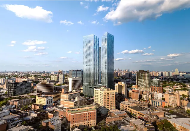 a open kitchen with stainless steel appliances granite countertop a stove top oven a sink dishwasher a dining table and chairs with wooden floor