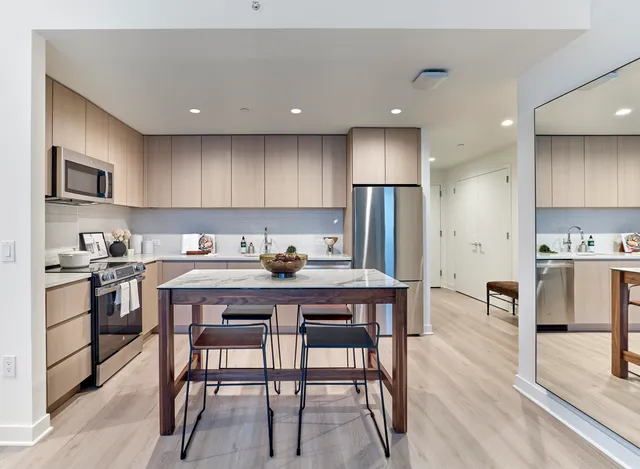 a bedroom with a large bed and a large window