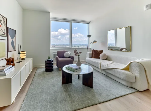 a bathroom with a toilet sink and shower