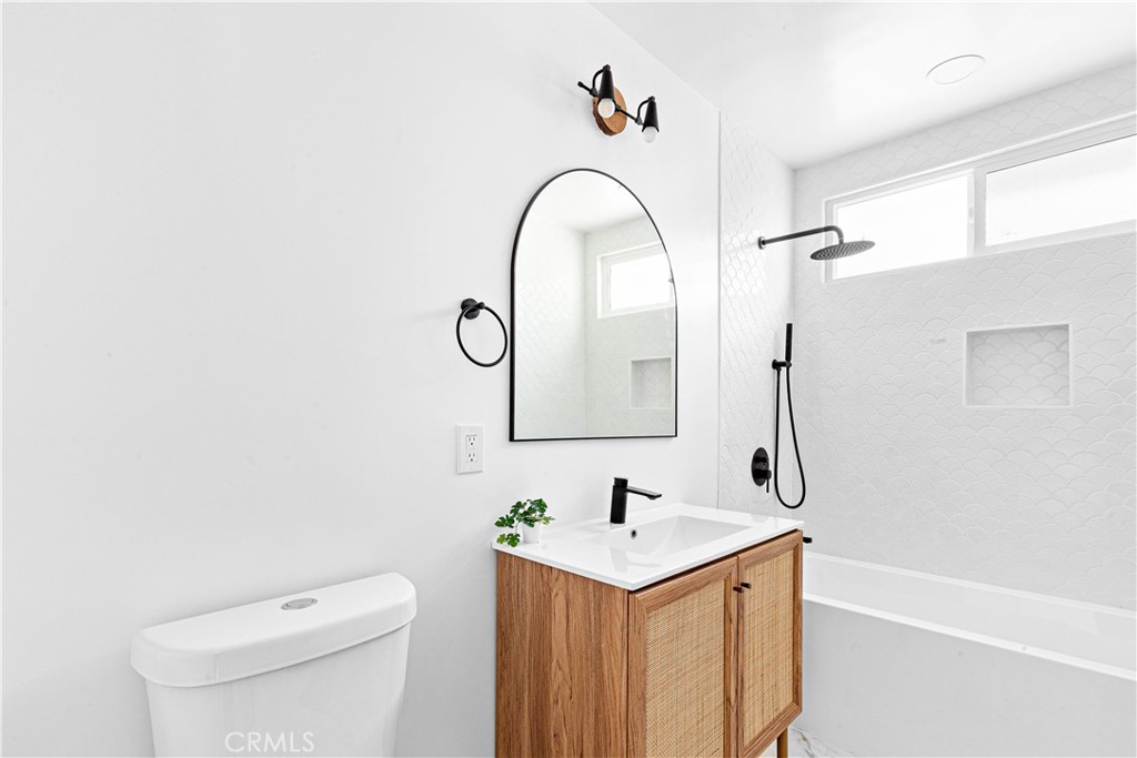 950 Morada Place Altadena, CA 91001 - Photo 16 of 30 a bathroom with a sink a toilet and a mirror