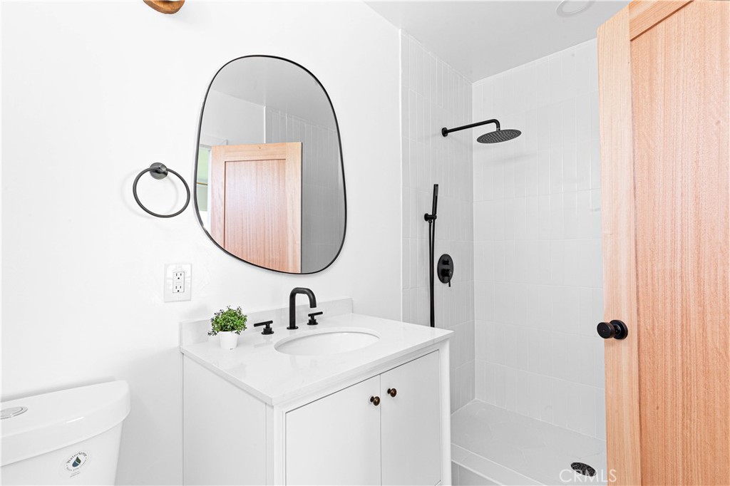 950 Morada Place Altadena, CA 91001 - Photo 18 of 30 a bathroom with a sink and a mirror