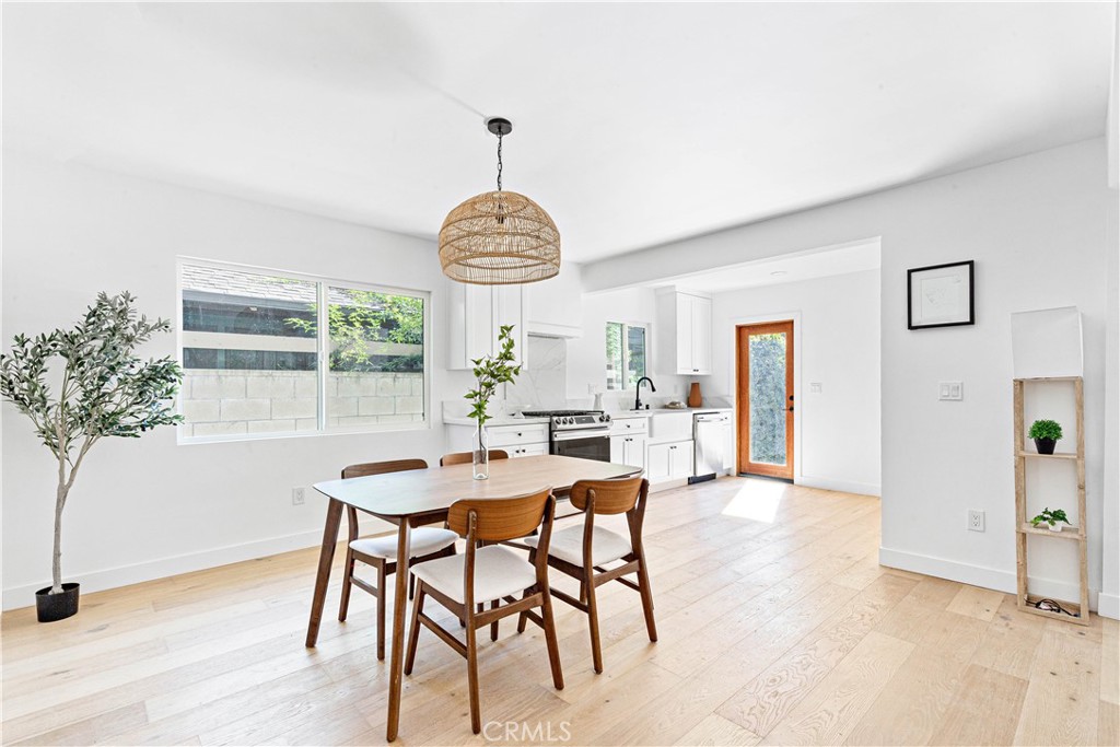 950 Morada Place Altadena, CA 91001 - Photo 10 of 30 a view of a dining room and livingroom with furniture window and wooden floor