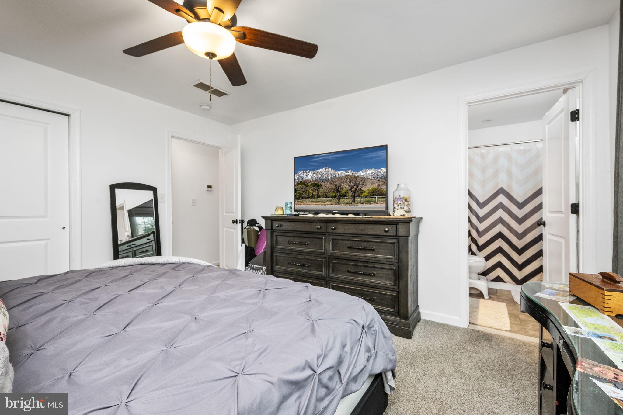 1915 Larkin Road Upper Chichester, PA 19061 - Photo 14 of 23 a bedroom with a bed and a chandelier