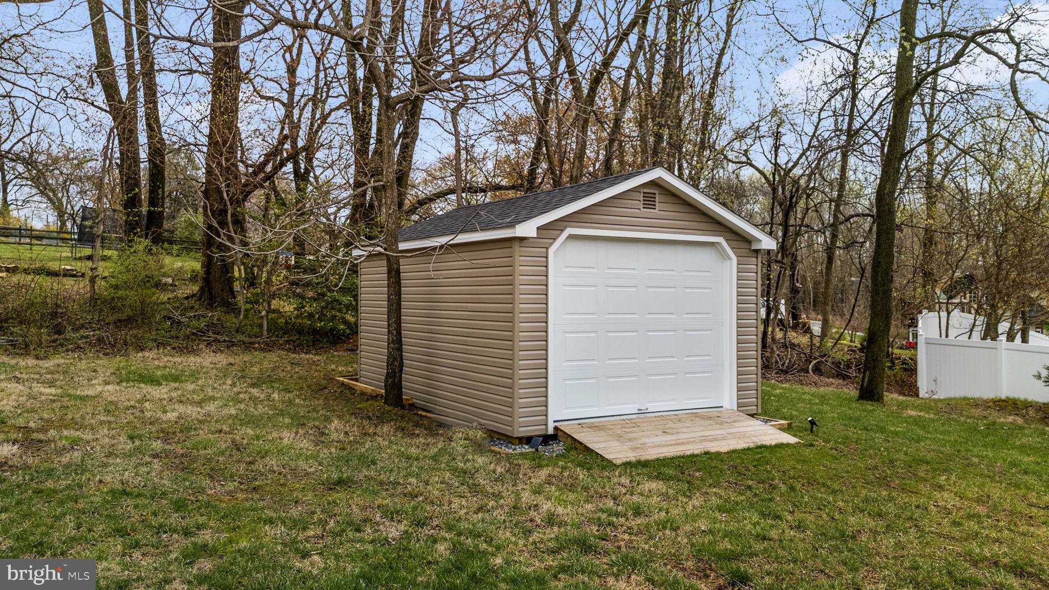 1915 Larkin Road Upper Chichester, PA 19061 - Photo 17 of 23 a small barn in front of a house with a garden