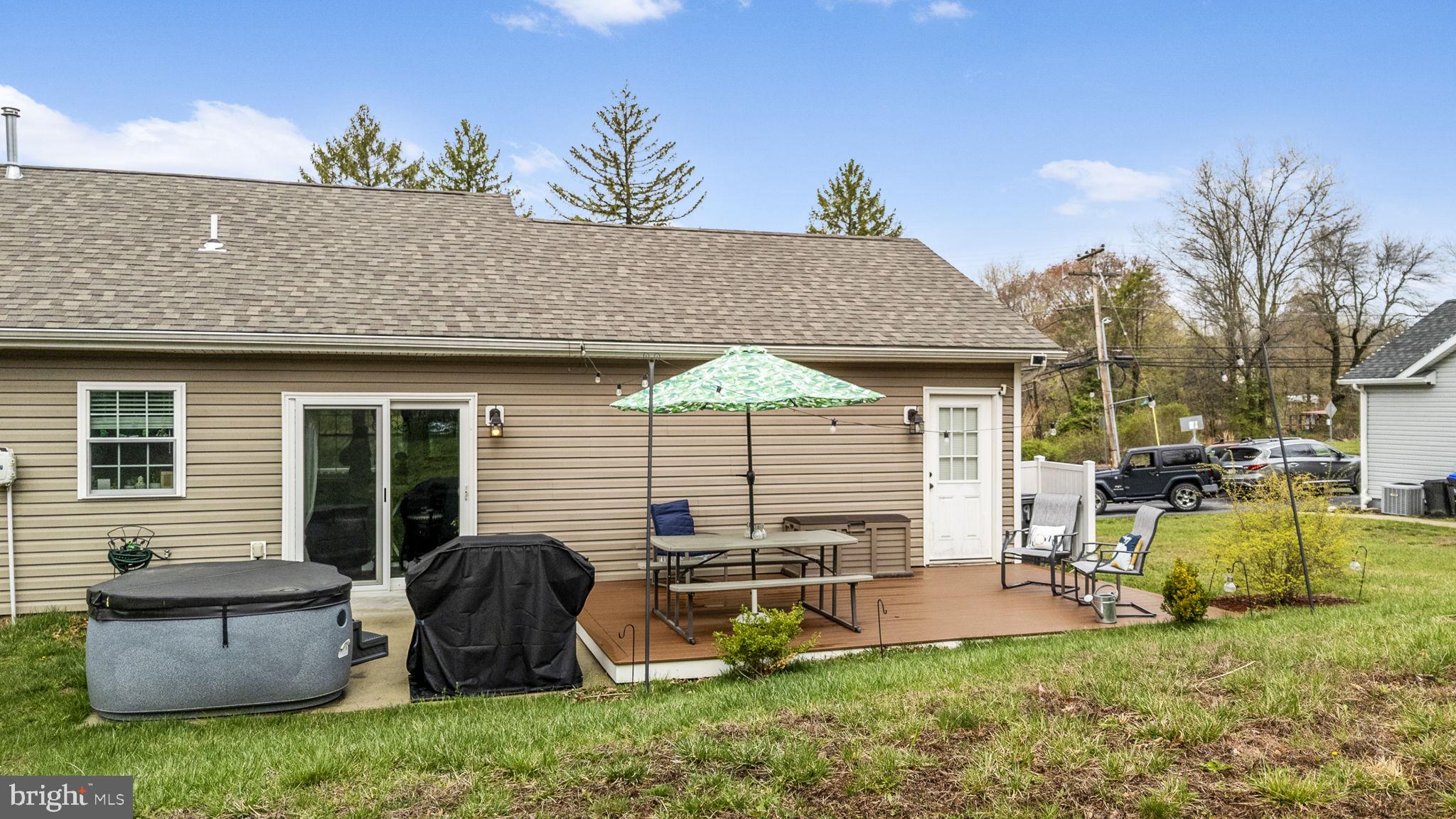 1915 Larkin Road Upper Chichester, PA 19061 - Photo 19 of 23 a backyard of a house with table and chairs