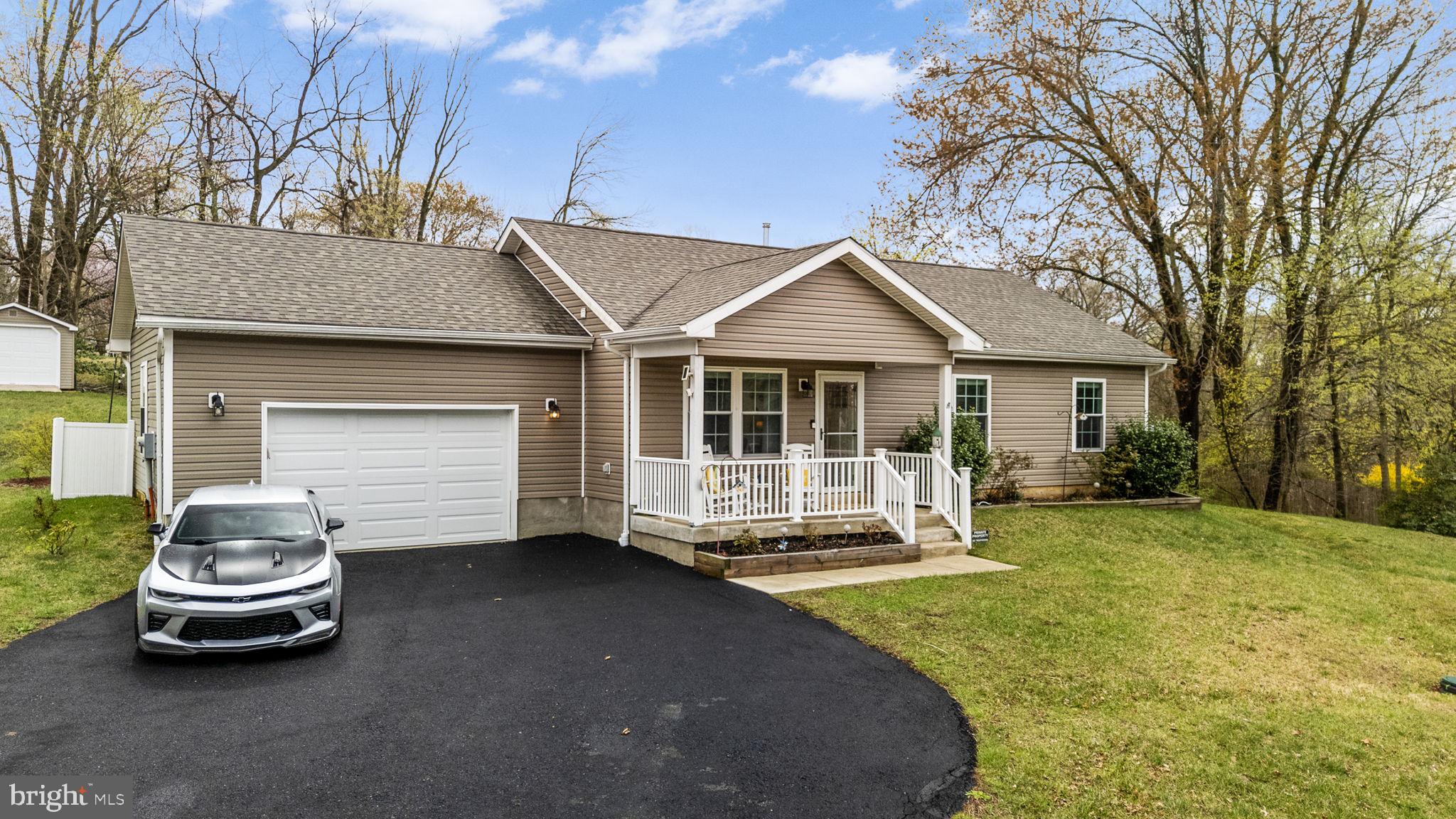1915 Larkin Road Upper Chichester, PA 19061 - Photo 2 of 23 a house view with a garden space