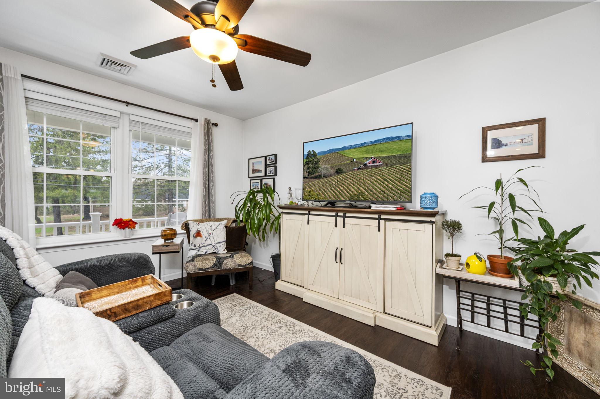1915 Larkin Road Upper Chichester, PA 19061 - Photo 9 of 23 a living room with furniture and a flat screen tv