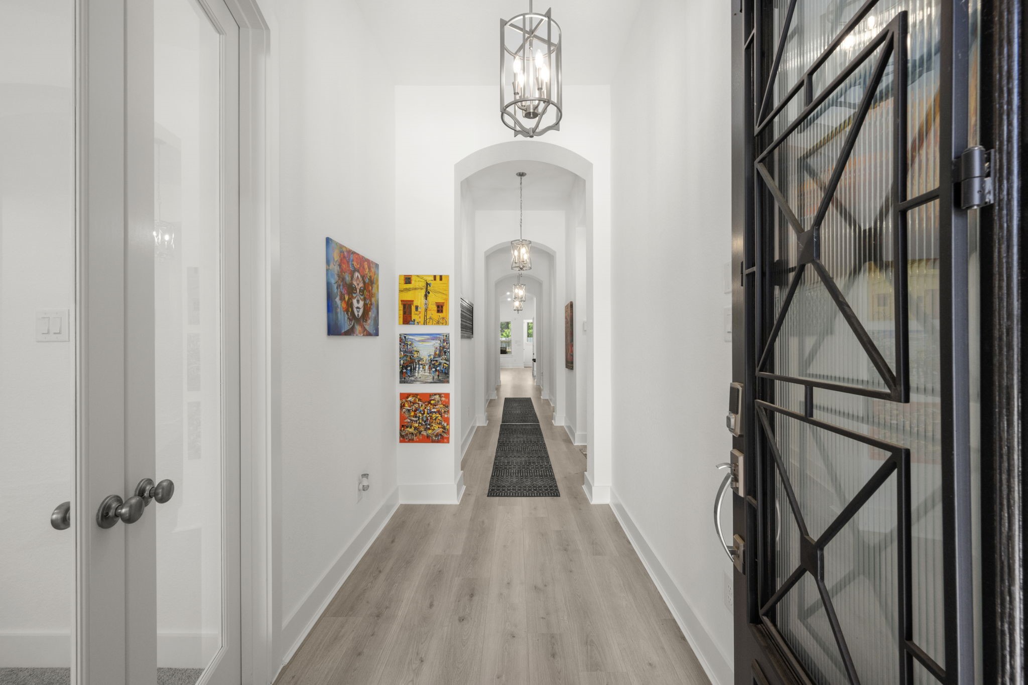 13035 Wandering Rdg Lane Conroe, TX 77302 - Photo 4 of 28 a view of hallway with wooden floor