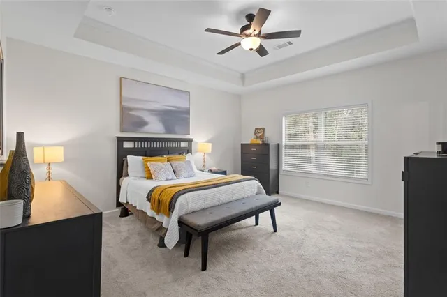 a bedroom with a bed and a couch