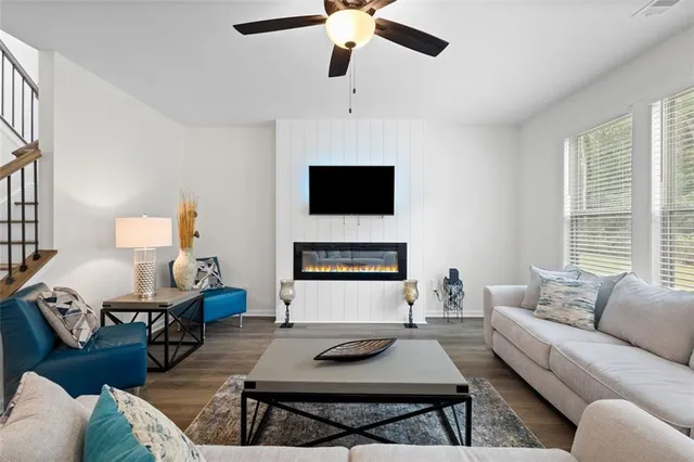 a living room with furniture and a fireplace