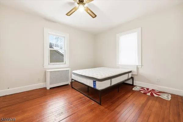 a room with a bed and a window