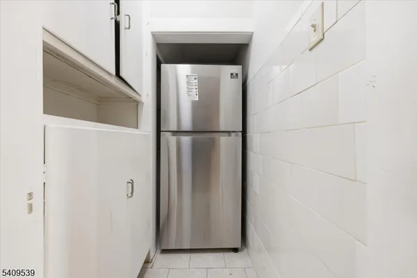 a white refrigerator freezer and a dishwasher sitting inside of a kitchen