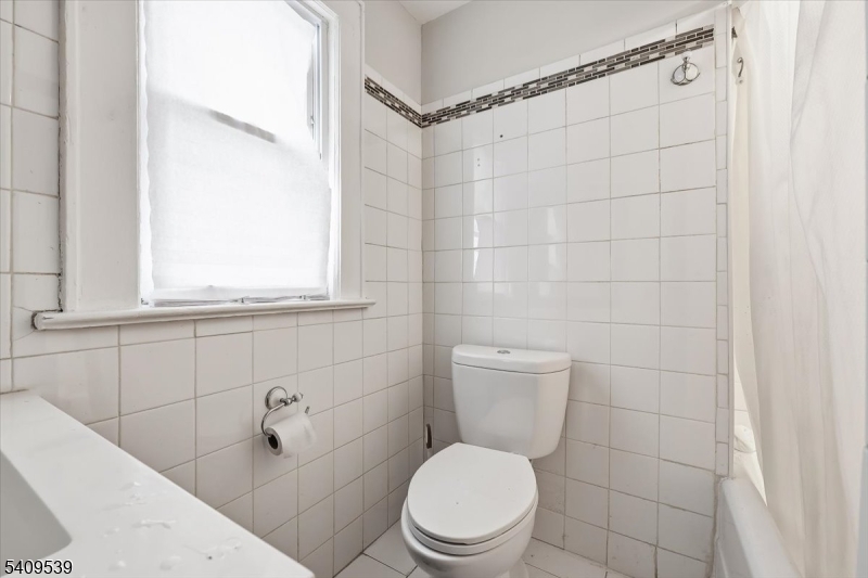 57 Menzel Avenue Maplewood, NJ 07040 - Photo 19 of 21 a white toilet sitting next to a bathroom sink