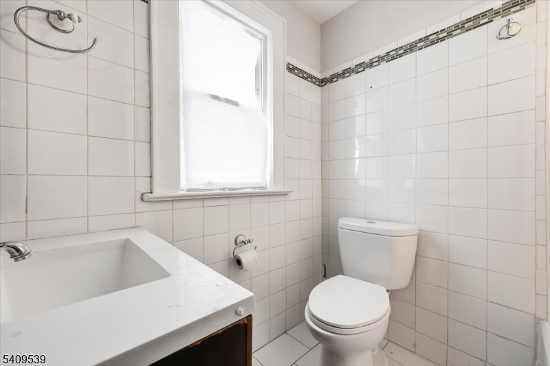 57 Menzel Avenue Maplewood, NJ 07040 - Photo 20 of 21 a white toilet sitting next to a bathroom sink