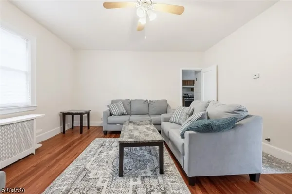a living room with furniture and a rug
