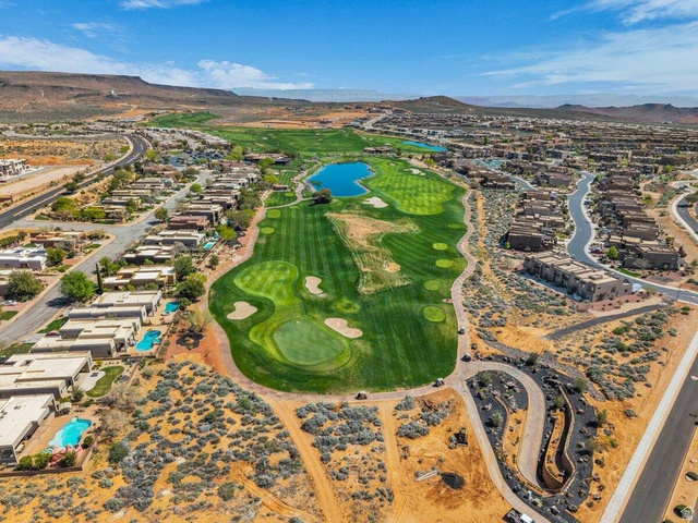 5010 Escapes Drive St. George, UT 84770 - Photo 34 of 46 Aerial view of residential area with a water and mountain view and a local golf course