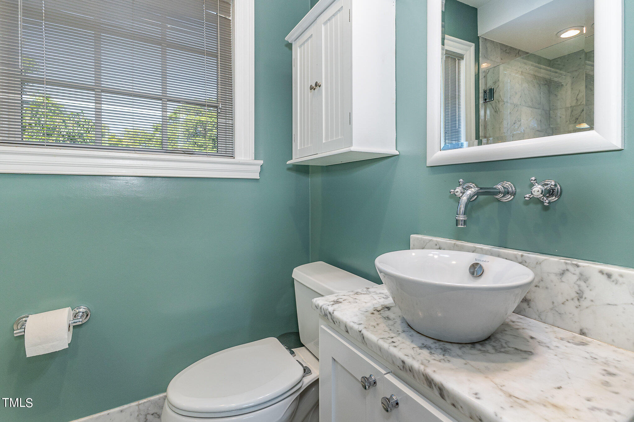 1629 St Marys Street Raleigh, NC 27608 - Photo 23 of 39 Carrera marble counter & Dorn and Duravit bath fixtures.