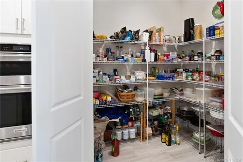 a bathroom with a granite countertop sink mirror and shower