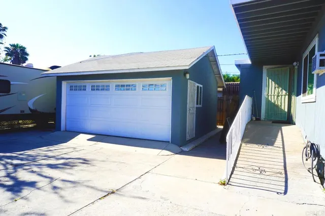 a view of backyard with garage