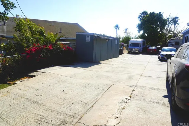 a view of a backyard of the house