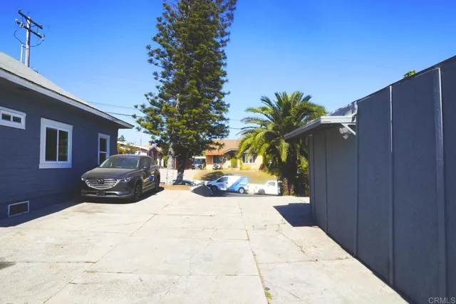 a view of a two chairs in the patio