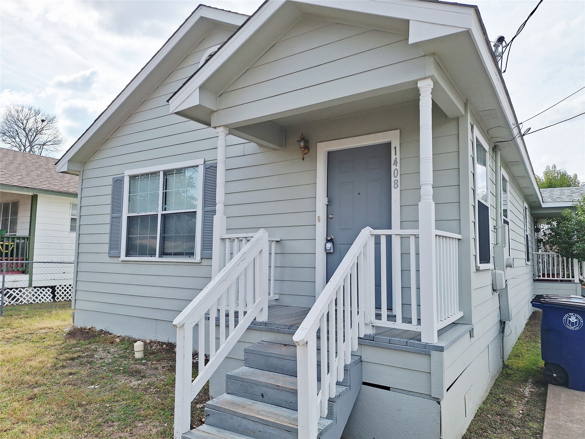 1408 Perez Street, Unit A Austin, TX 78721 - Photo 1 of 12 a view of a house with wooden floor fence and a porch