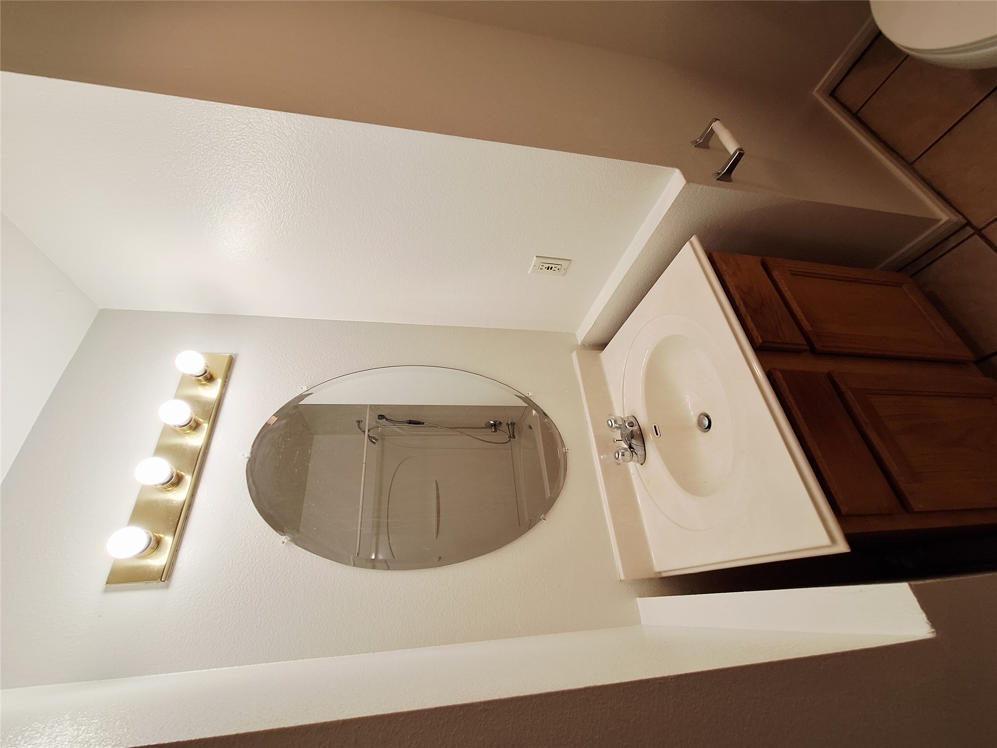 1408 Perez Street, Unit A Austin, TX 78721 - Photo 11 of 12 a bathroom with a sink and a mirror