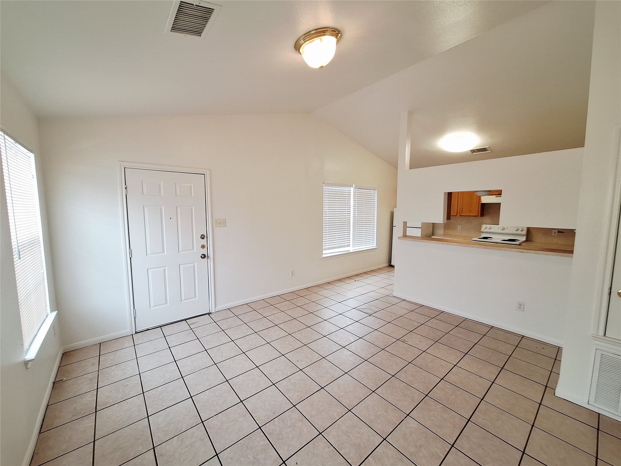 1408 Perez Street, Unit A Austin, TX 78721 - Photo 2 of 12 a view of a livingroom with an empty space and a window