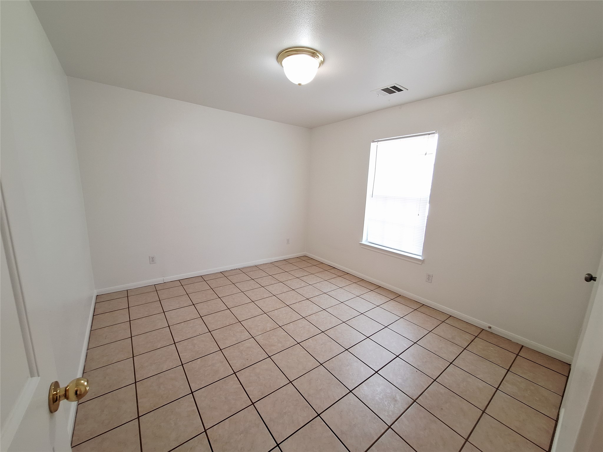 1408 Perez Street, Unit A Austin, TX 78721 - Photo 8 of 12 a view of an empty room and window
