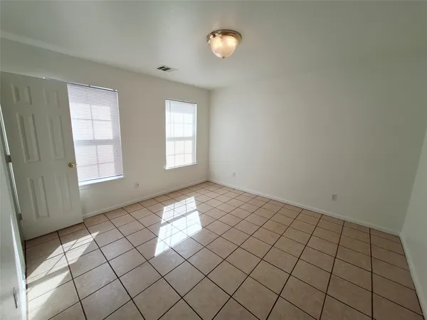 a view of an empty room and window