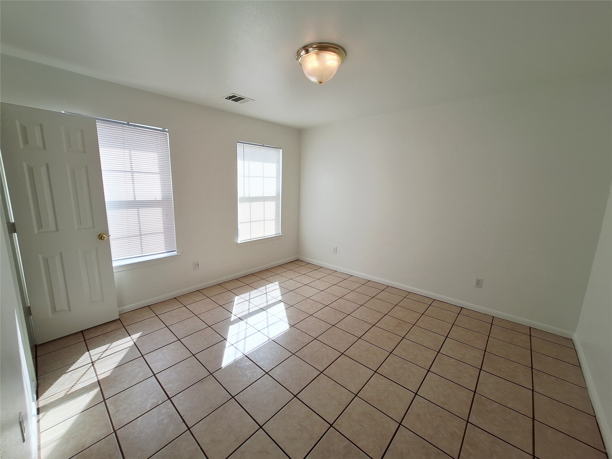 1408 Perez Street, Unit A Austin, TX 78721 - Photo 9 of 12 a view of an empty room and window