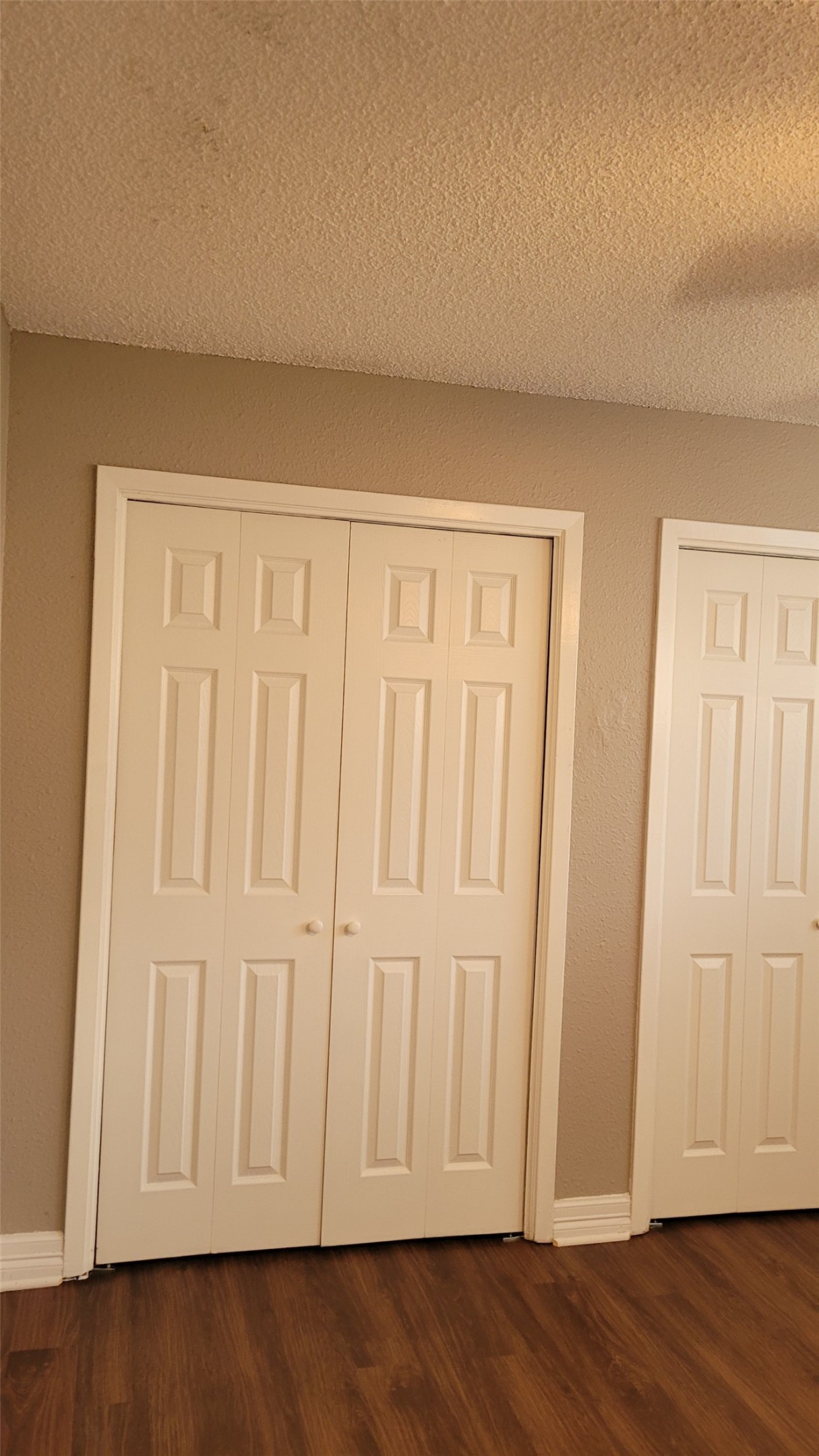 8804 Schick Road, Unit C Austin, TX 78729 - Photo 13 of 26 Detailed view of a textured ceiling, wood finished floors, and a ceiling fan