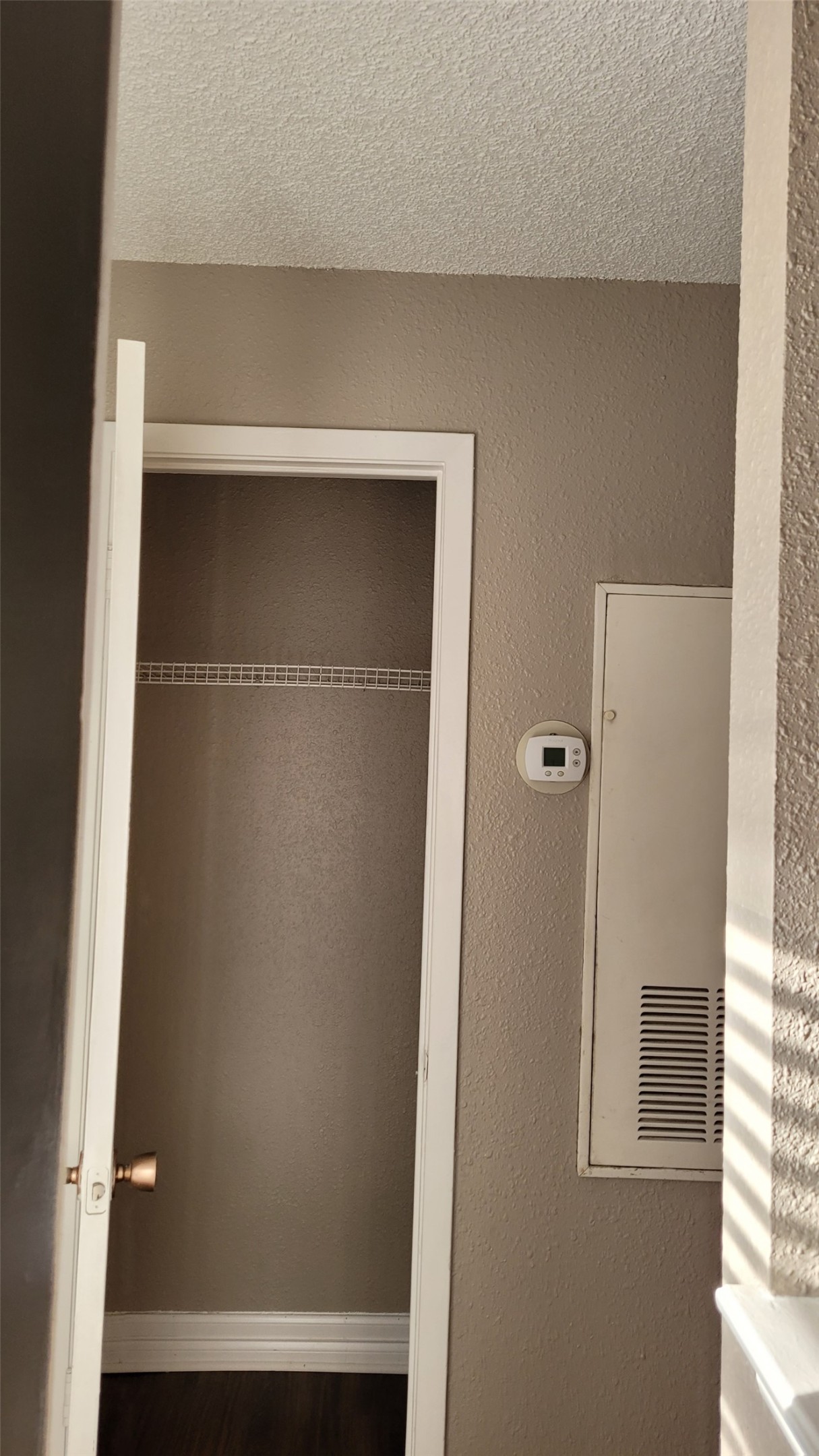 8804 Schick Road, Unit C Austin, TX 78729 - Photo 9 of 26 Bathroom featuring a textured wall, a textured ceiling, and a heating unit