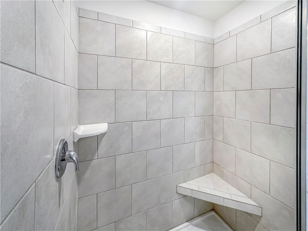 965 Athena Bend Fairburn, GA 30213 - Photo 14 of 37 a bathroom with a shower