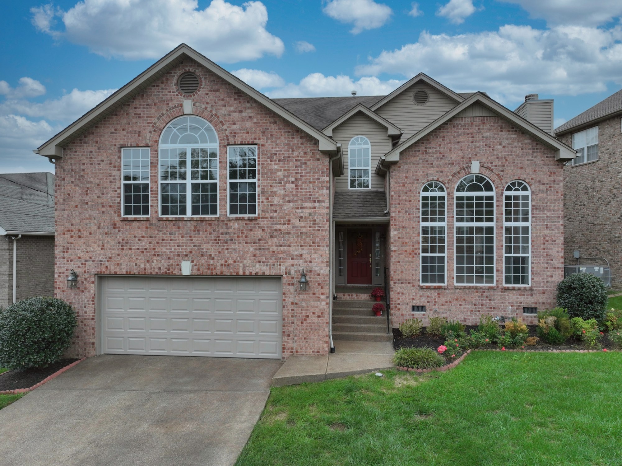 7309 Smokey Hill Road Antioch, TN 37013 - Photo 2 of 88 a front view of a house with a yard and garage