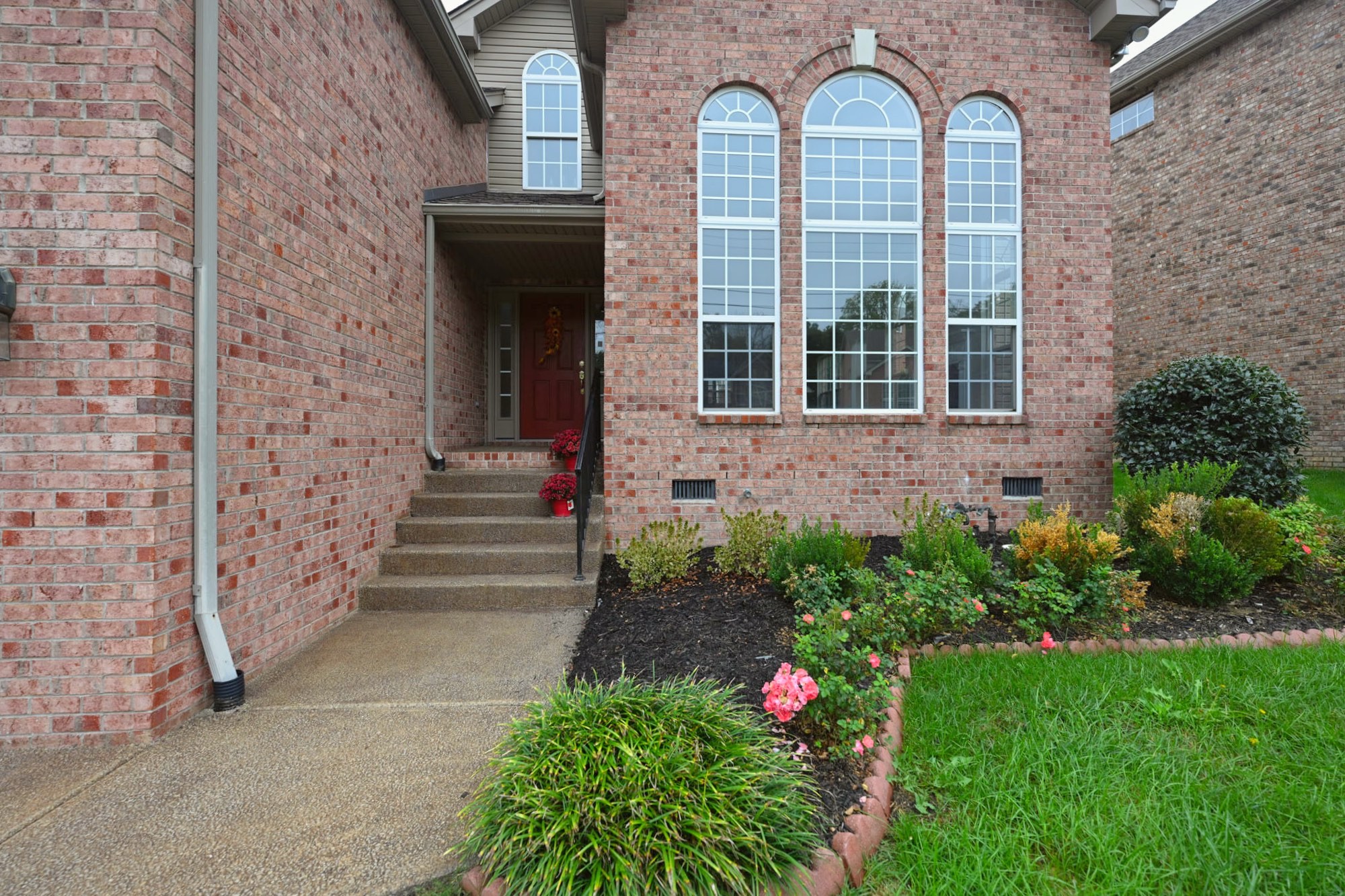 7309 Smokey Hill Road Antioch, TN 37013 - Photo 22 of 88 a front view of a house with a garden