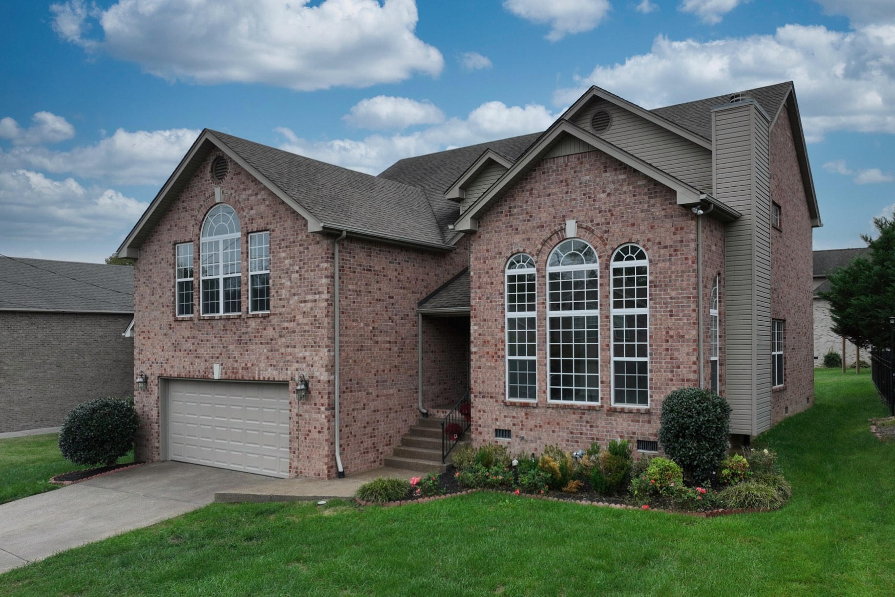 7309 Smokey Hill Road Antioch, TN 37013 - Photo 3 of 88 a front view of a house with a garden and plants