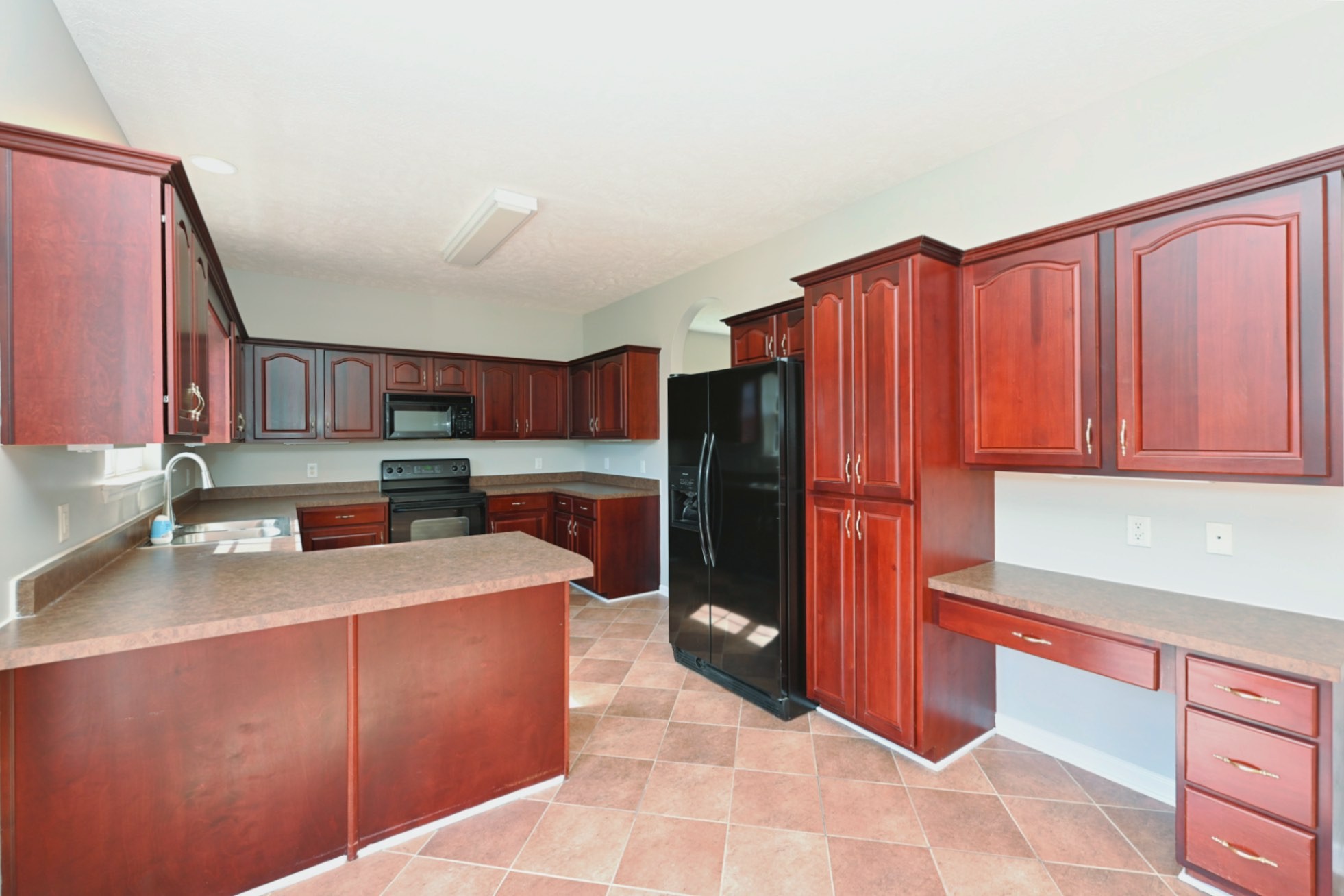 7309 Smokey Hill Road Antioch, TN 37013 - Photo 34 of 88 a kitchen with stainless steel appliances granite countertop a refrigerator and a sink