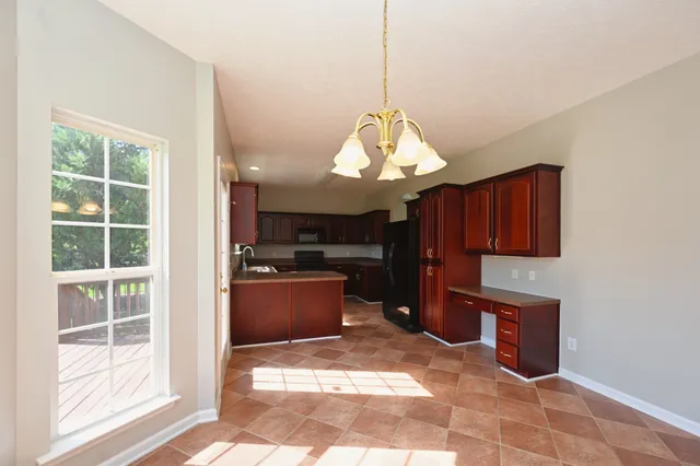 an empty room with a empty space and a ceiling fan