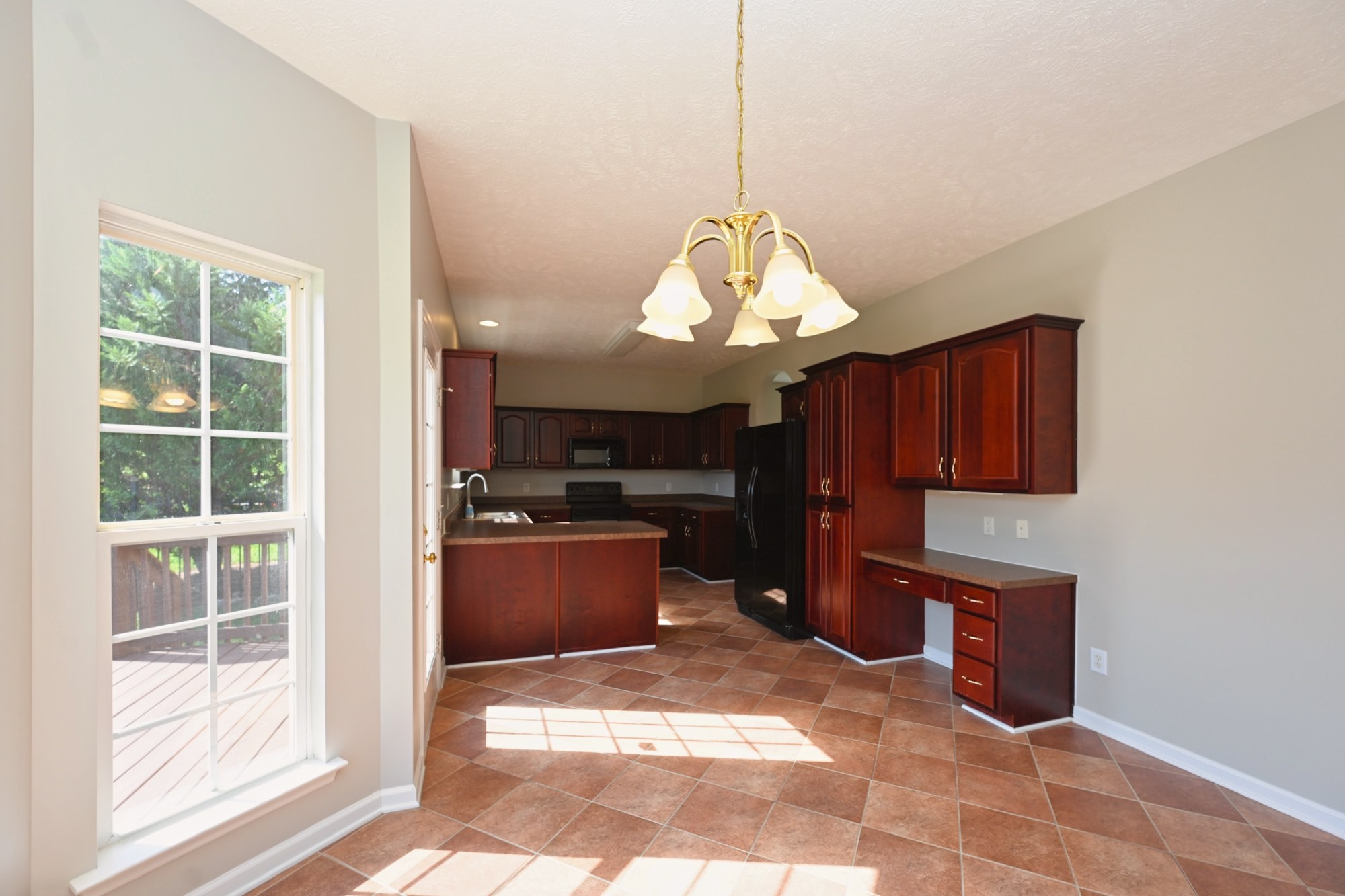 7309 Smokey Hill Road Antioch, TN 37013 - Photo 38 of 88 a kitchen with stainless steel appliances granite countertop a stove a refrigerator a sink a microwave oven and a dining table with wooden floor