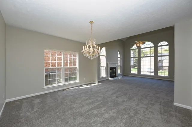 a spacious bathroom with a double vanity sink and a mirror