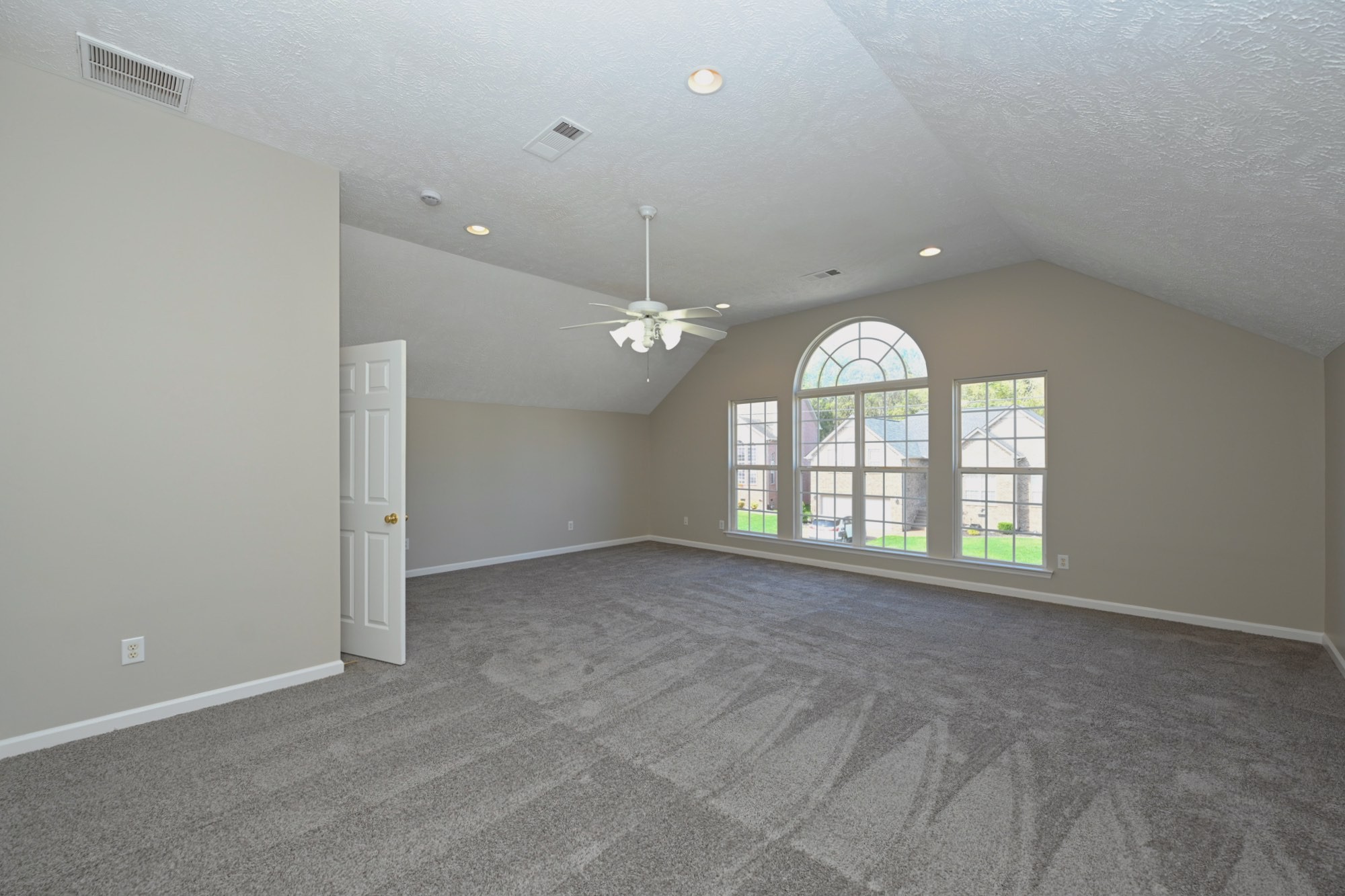7309 Smokey Hill Road Antioch, TN 37013 - Photo 69 of 88 an empty room with large windows and ceiling fan