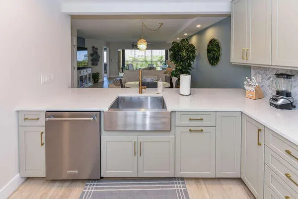 a kitchen with cabinets and window