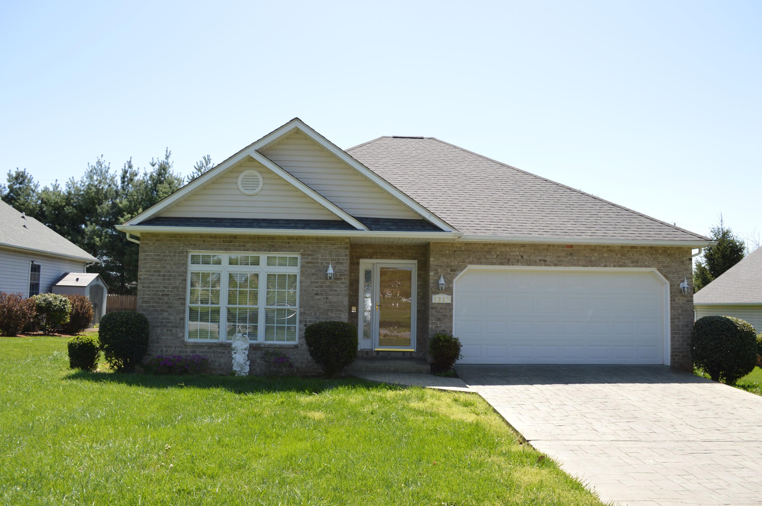 2231 Countryside Road Northwest Roanoke, VA 24017 - Photo 1 of 28 a front view of a house with a garden and yard