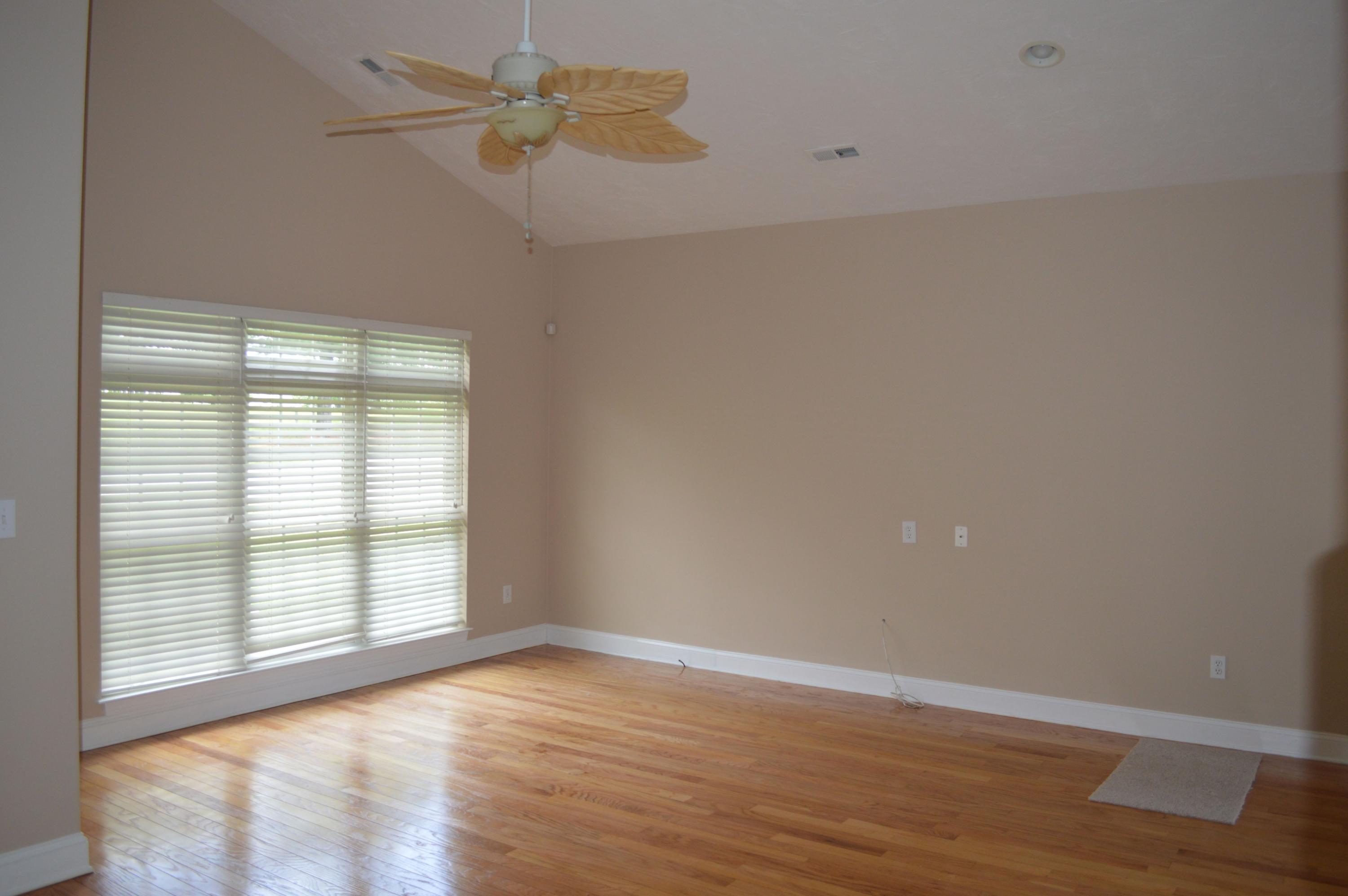 2231 Countryside Road Northwest Roanoke, VA 24017 - Photo 4 of 28 wooden floor in an empty room with a window