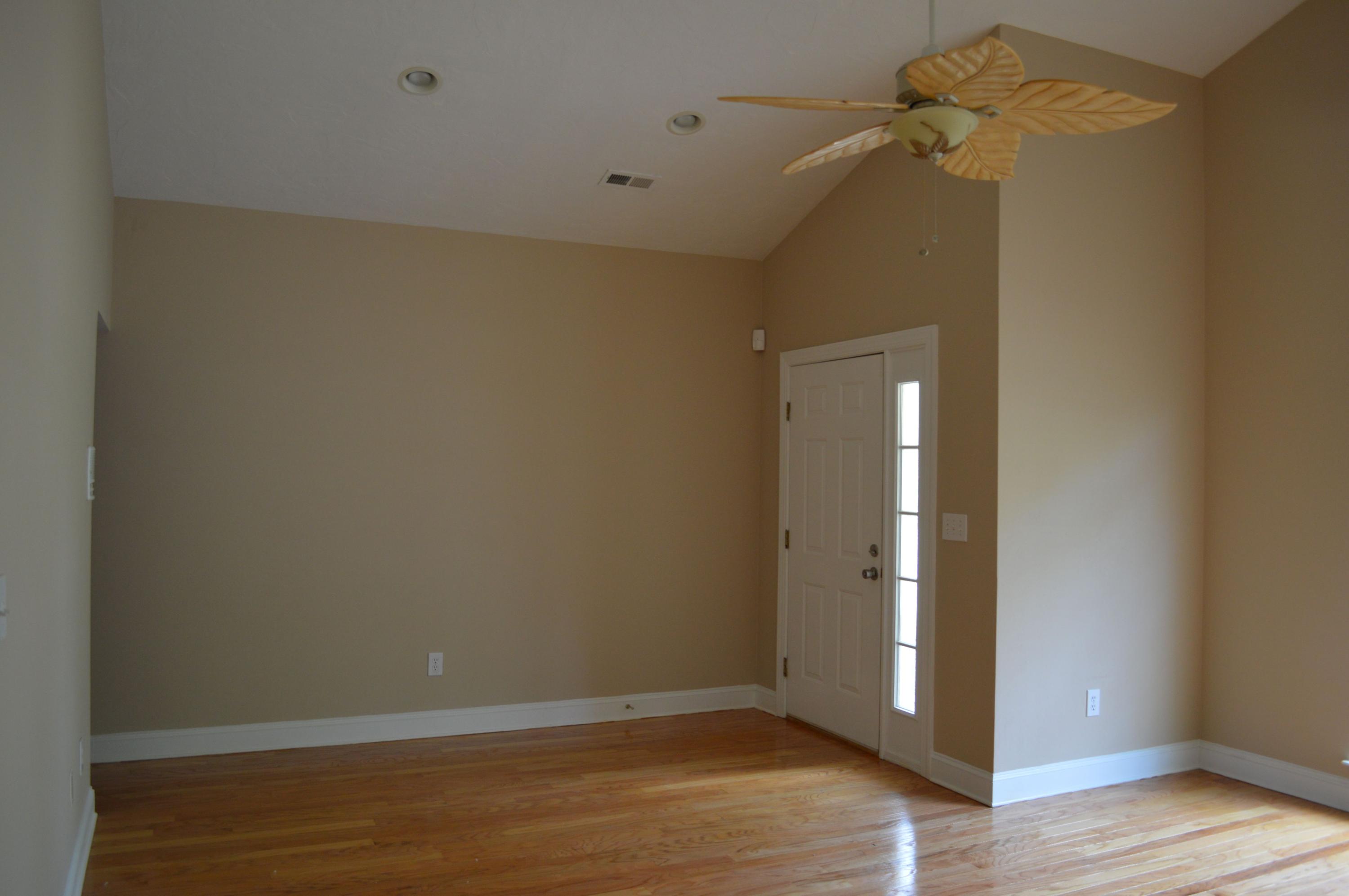2231 Countryside Road Northwest Roanoke, VA 24017 - Photo 5 of 28 a view of a room with wooden floor and a ceiling fan